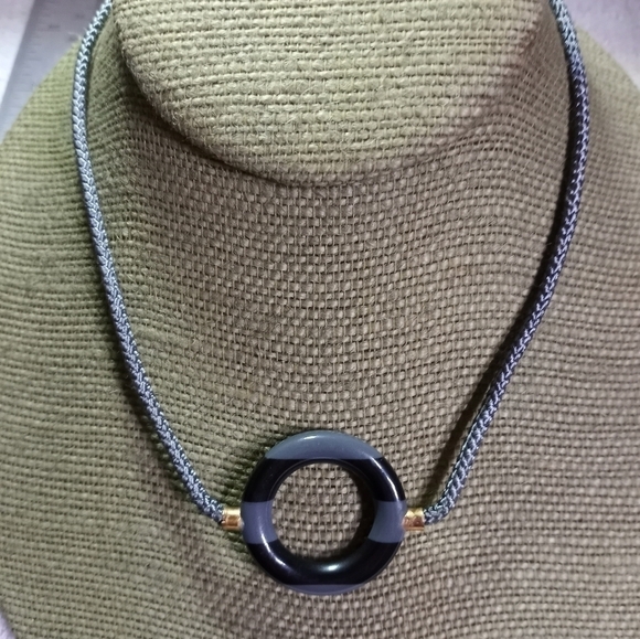 Goldtone gray black round donut pendant on gray cord necklace - Picture 1 of 3